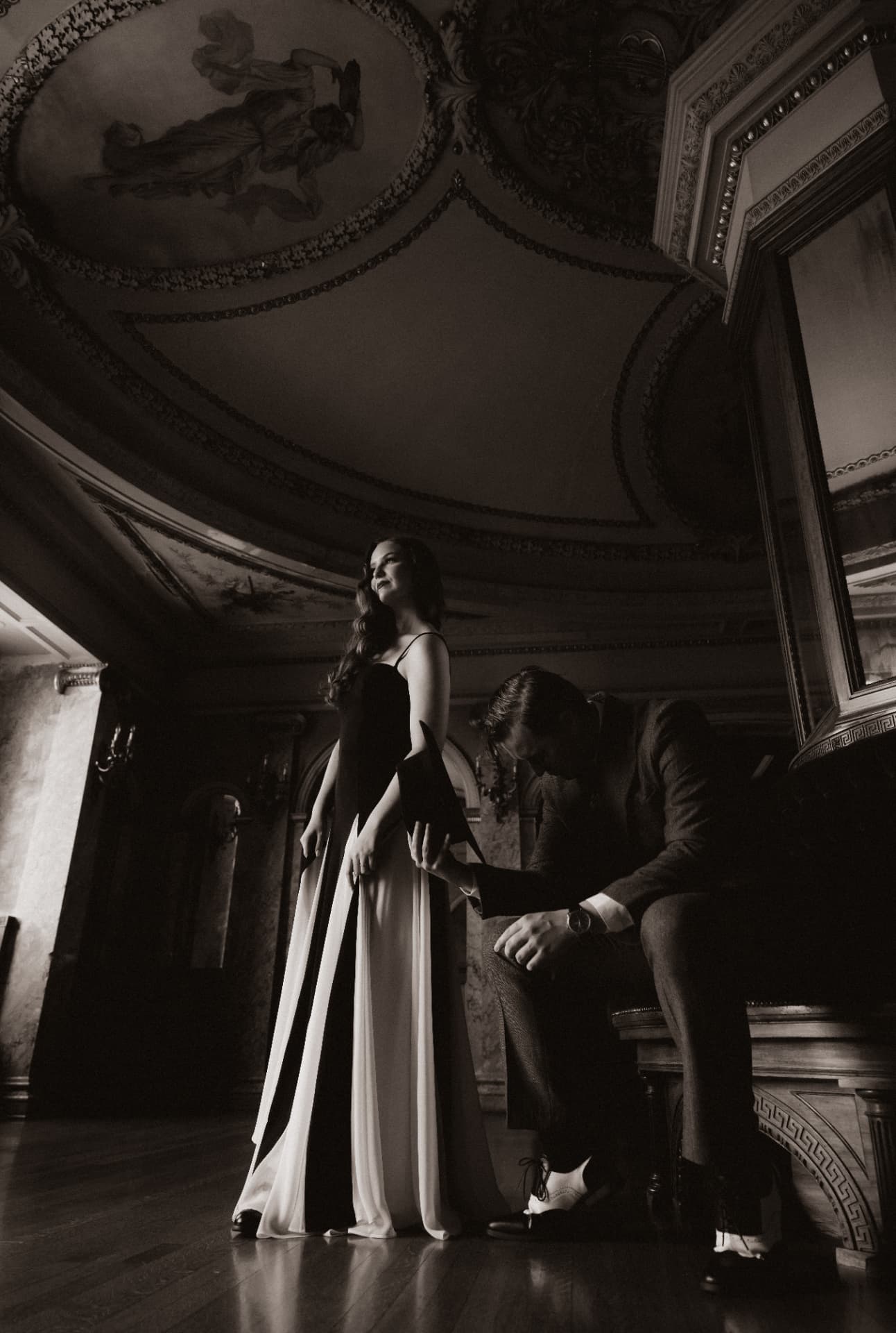 Olympia in a bias-cut gown beneath a domed ceiling